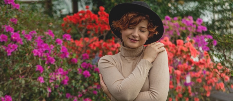 Woman hugging herself 